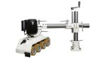 SCM formula power feeder mounted on a shaper table